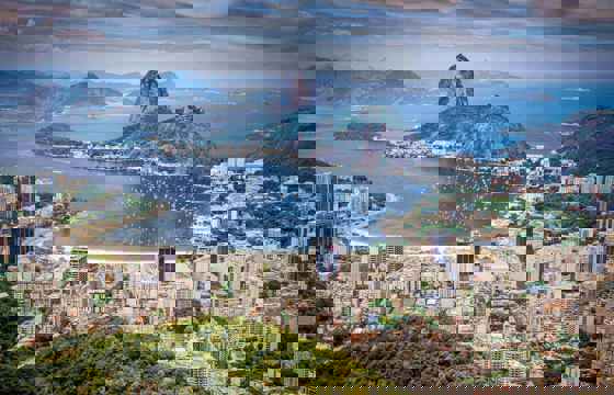 South America - Brazil, aerial view of Rio de Janeiro with Sugarloaf Mountain and the city's coastline.