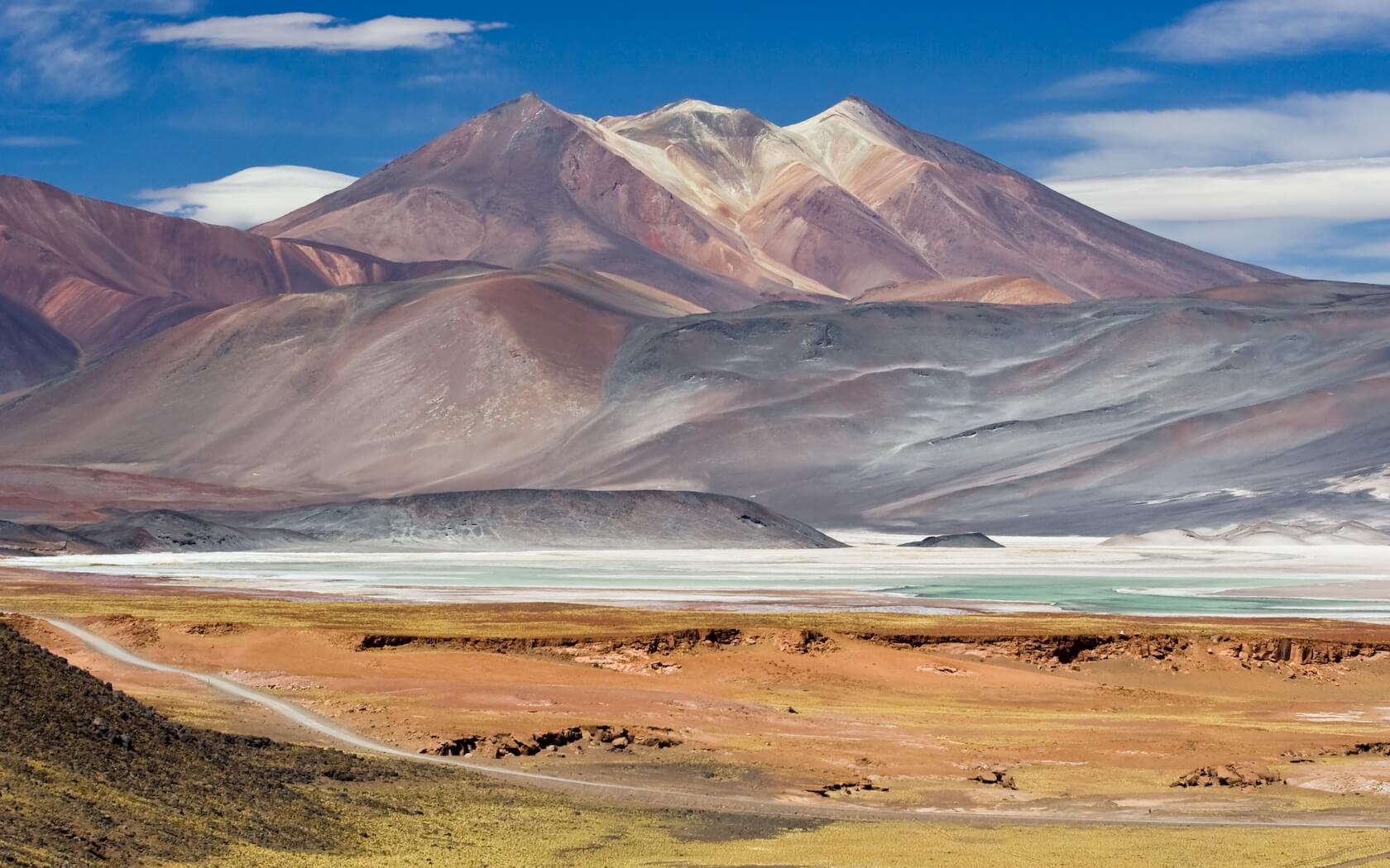 Multicolored mountains and salt flats in the Chilean Altiplano near San Pedro de Atacama. 